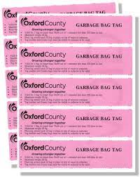 sheet of pink garbage bag tag stickers