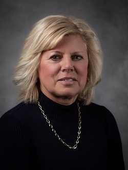 Councillor Deb Tait, with shoulder length blond hair wearing a black coloured top