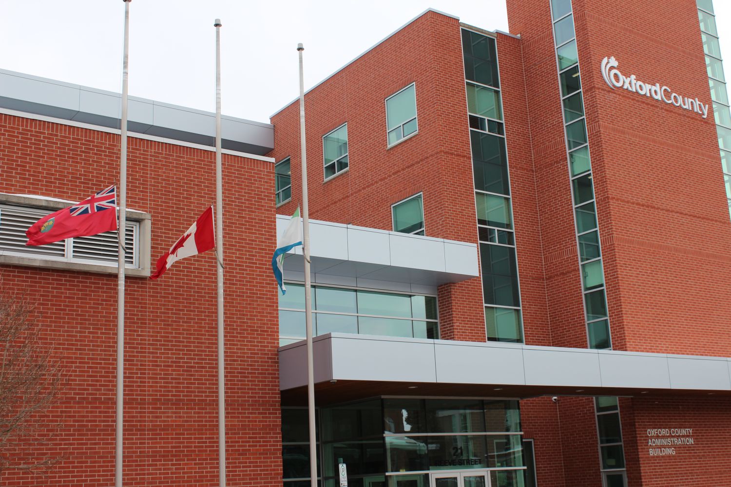 flags flying at half-mast for the National Day of Remembrance and Action Against Violence Against Women