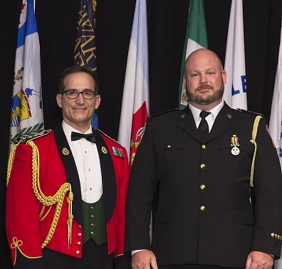 Ryan Hall receiving Exemplary Service Medal