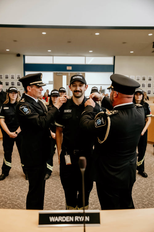 Paramedic receiving epaulettes during the Oxford County ceremony