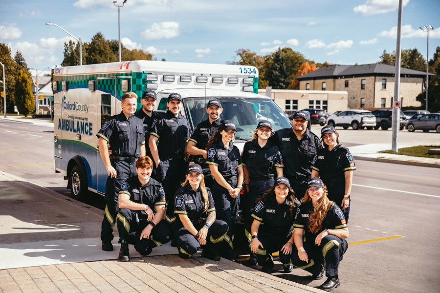 New Oxford County paramedics gathered outside with an ambulance