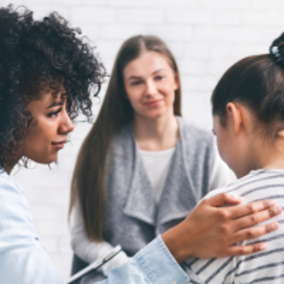 A woman receives support from other women