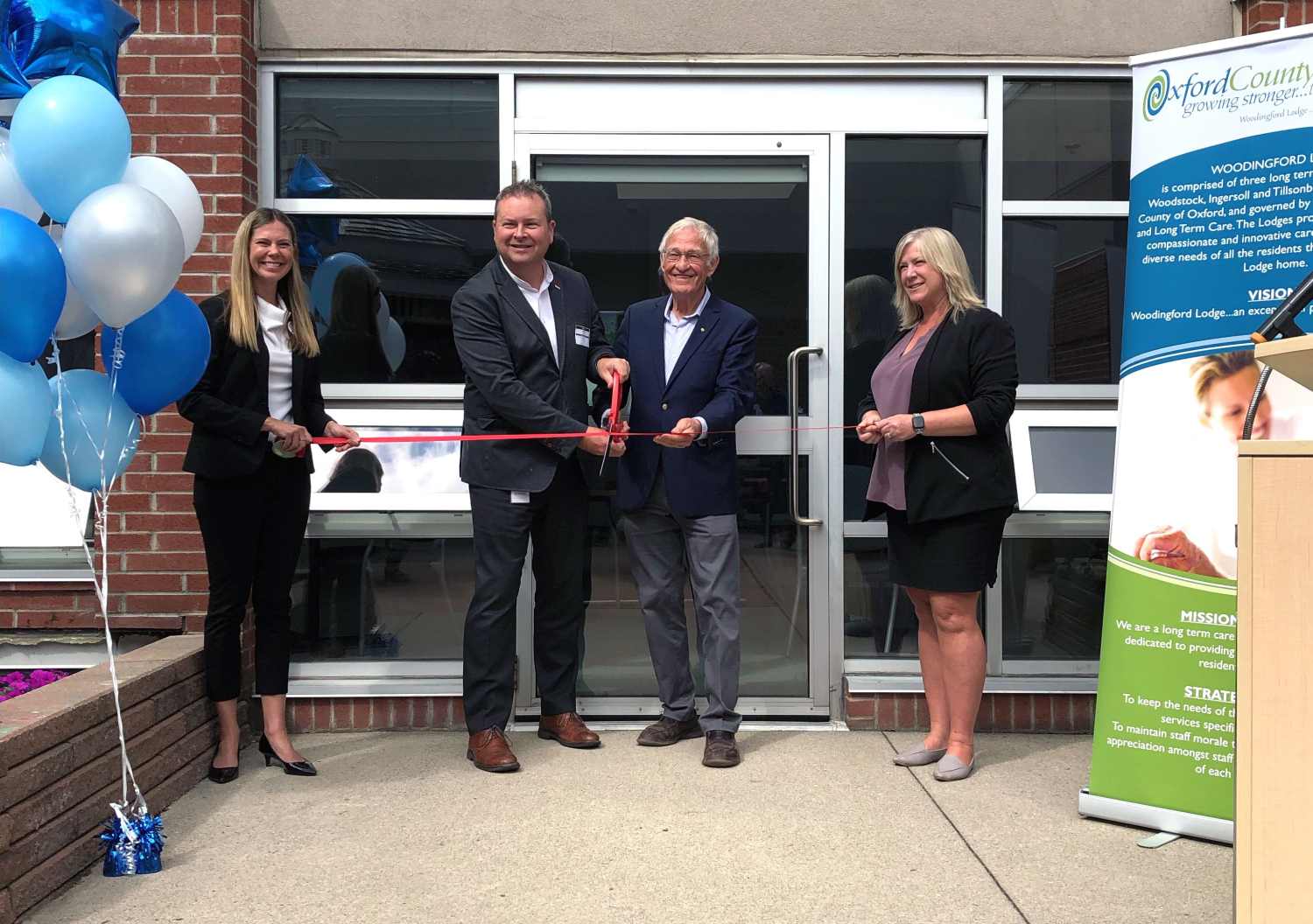 Warden Ryan, Mark Dager, Amie Walker, Ernie Hardeman cutting the ribbon for the new adult day program